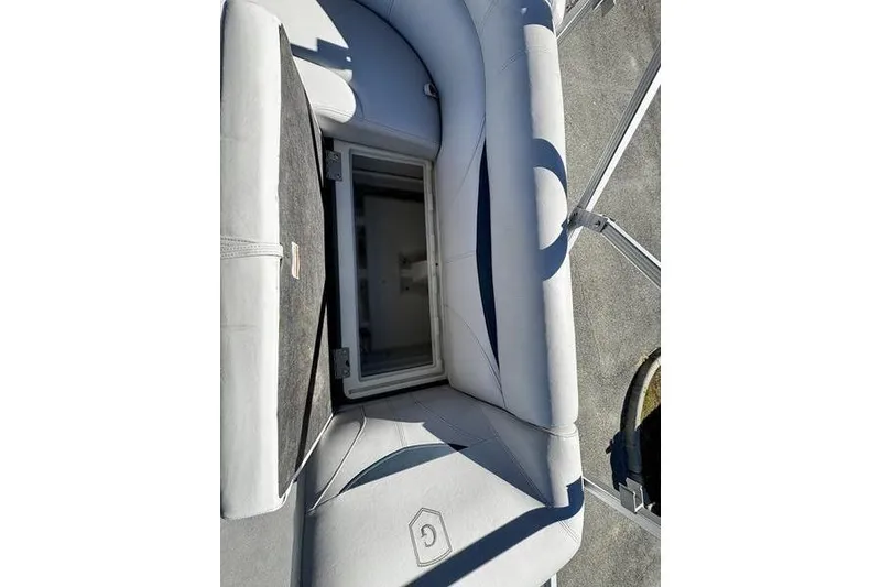 Slide: The Image of 2018 Godfrey Sweetwater 2086 C boat seat with open storage compartment. - 14