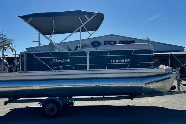Slide: The Image of 2018 Godfrey Sweetwater 2086 C pontoon boat with canopy on trailer. - 2