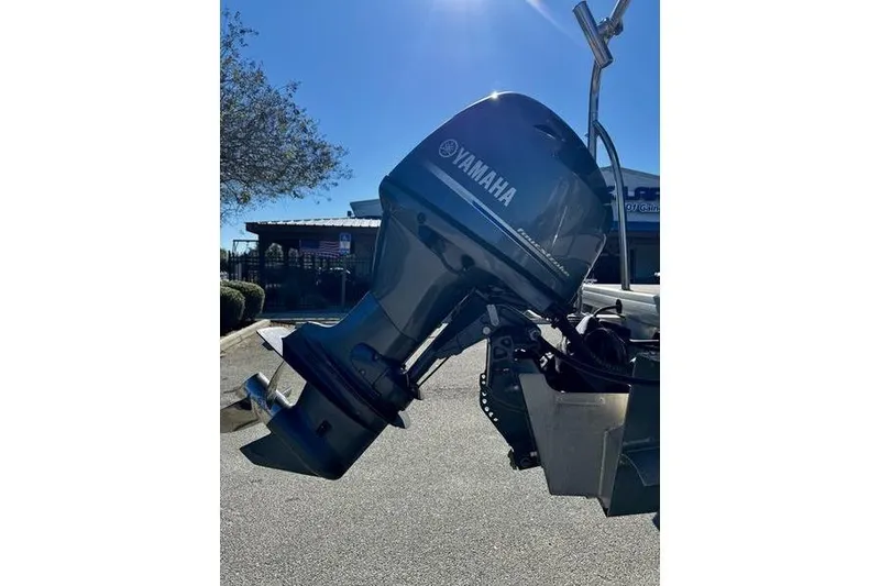Slide: The Image of Yamaha outboard motor on 2018 Godfrey Sweetwater 2086 C boat, parked outdoors. - 4