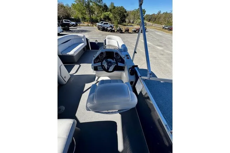 Slide: The Image of 2018 Godfrey Sweetwater 2086 C pontoon boat interior with steering console and seating. - 6