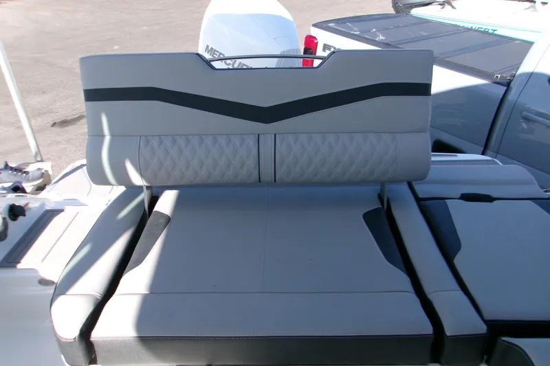 Slide: The Image of 2026 Monterey Elite 25 OB boat with luxurious gray seating and modern design. - 10