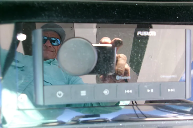 Slide: The Image of Reflection on Fusion stereo display in 2026 Monterey Elite 25 OB boat. - 14