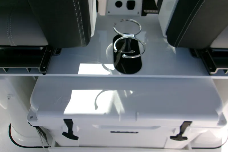 Slide: The Image of 2026 Monterey Elite 25 OB boat interior with seating and storage compartment. - 20