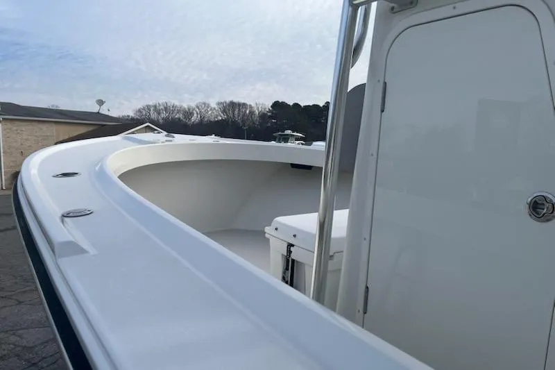 Slide: The Image of 2022 Parker 2100 Special Edition boat, white deck, clear sky background. - 4