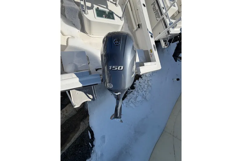 Slide: The Image of 2022 Parker 2100 Special Edition boat with Yamaha 150 outboard motor in snowy setting. - 8