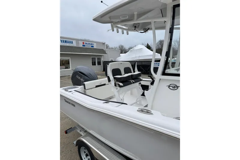 Slide: The Image of 2026 Tidewater 220 CC Adventure boat with Yamaha engine at dealership. - 12