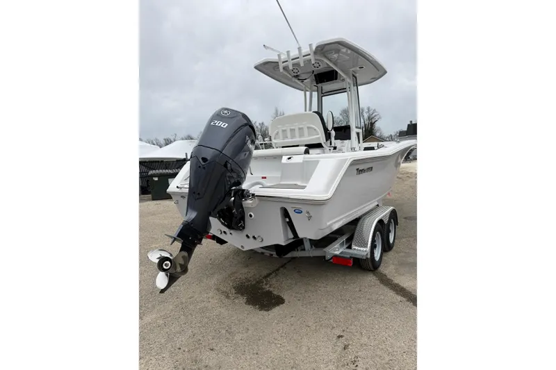 Slide: The Image of 2026 Tidewater 220 CC Adventure boat on trailer with powerful outboard motor. - 8