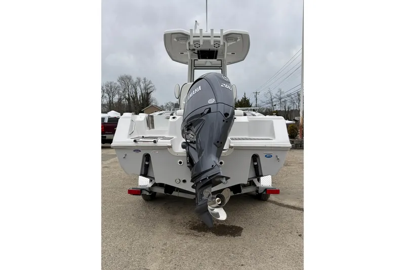 Slide: The Image of 2026 Tidewater 220 CC Adventure boat with Yamaha outboard motor, rear view. - 9