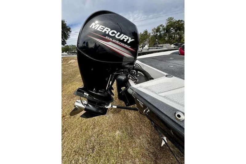 Slide: The Image of 2018 Ranger Z185 boat with Mercury FourStroke outboard motor on grassy area. - 4