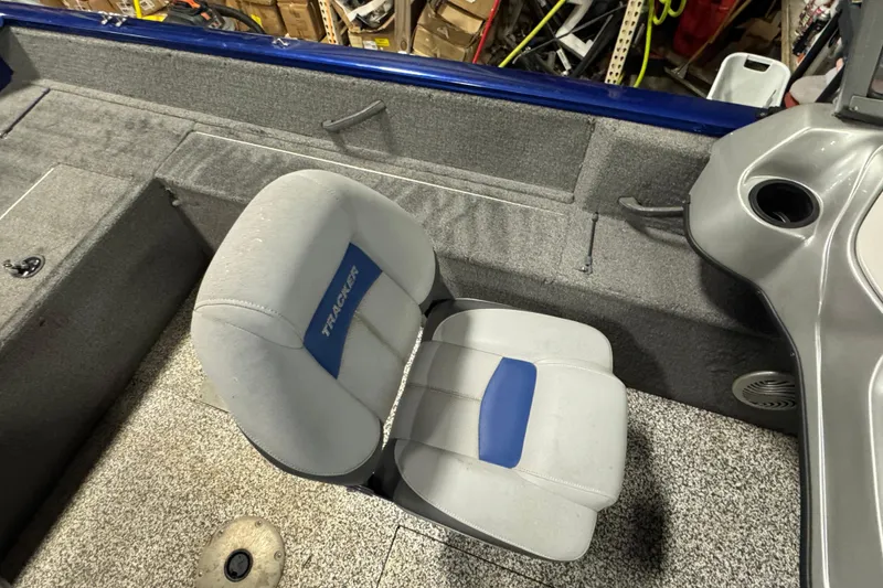 Slide: The Image of 2014 Tracker Pro Guide V-175 WT boat interior with gray and blue seating. - 11
