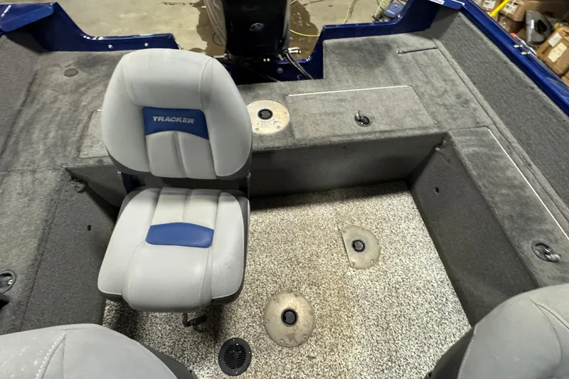 Slide: The Image of 2014 Tracker Pro Guide V-175 WT boat interior with seating and carpeted flooring. - 12