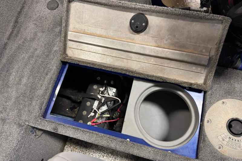 Slide: The Image of 2014 Tracker Pro Guide V-175 WT boat battery compartment with open hatch. - 16