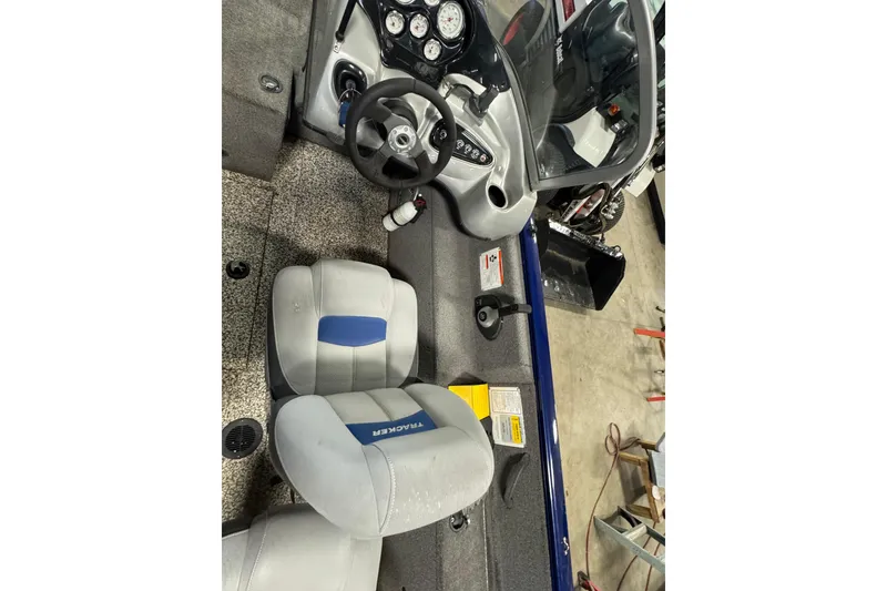 Slide: The Image of 2014 Tracker Pro Guide V-175 WT boat interior with steering wheel and seats. - 8