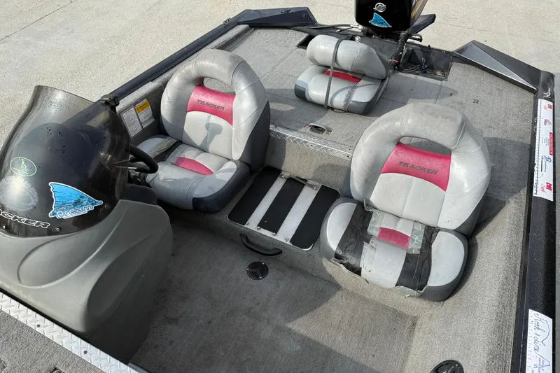 Slide: The Image of 2011 Bass Tracker PRO TEAM 190 TX boat interior with gray and pink seating. - 10