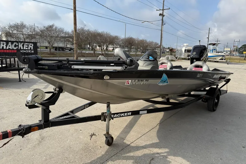 Slide: The Image of 2011 Bass Tracker PRO TEAM 190 TX boat on trailer, parked outdoors. - 3