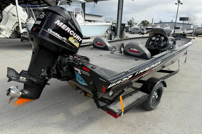 Slide: The Image of 2011 Bass Tracker PRO TEAM 190 TX boat with Mercury engine, parked on trailer. - 6