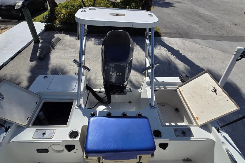 Slide: The Image of 2005 Sailfish 1900 BB Bay Boat with Yamaha 150 engine, open storage compartments. - 10