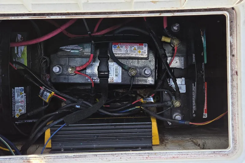 Slide: The Image of Battery compartment of a 2005 Sailfish 1900 BB Bay Boat with wiring connections. - 11