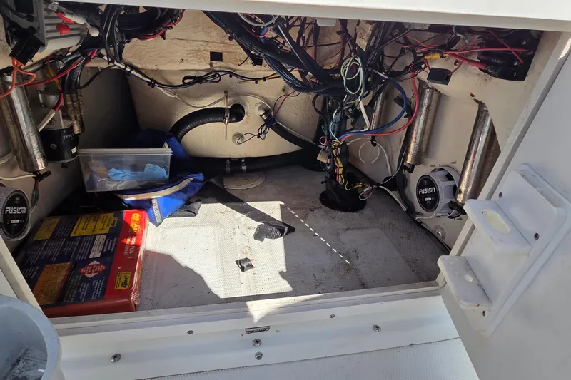Slide: The Image of Interior view of a 2005 Sailfish 1900 BB Bay Boat showing wiring and equipment. - 12