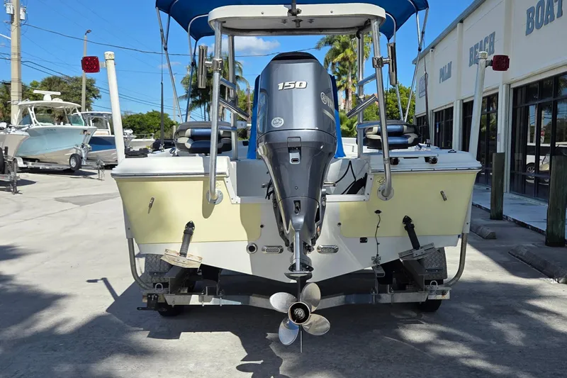 Slide: The Image of 2005 Sailfish 1900 BB Bay Boat with Yamaha 150 engine, parked outdoors. - 3