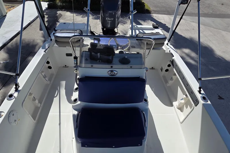Slide: The Image of 2005 Sailfish 1900 BB Bay Boat interior with steering console and seating. - 6