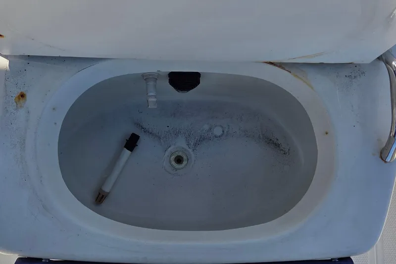 Slide: The Image of Livewell in 2005 Sailfish 1900 BB Bay Boat, showing interior details and wear. - 7