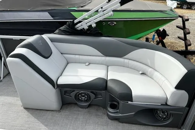 Slide: The Image of 2022 Tahoe Pontoon LTZ VRB/VRL with stylish seating and integrated speakers. - 10