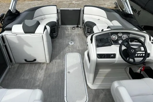 Slide: The Image of 2022 Tahoe Pontoon LTZ VRB/VRL interior with modern seating and steering console. - 13