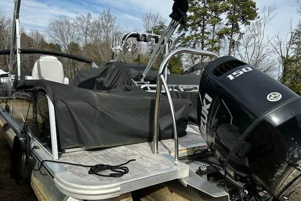 Slide: The Image of 2022 Tahoe Pontoon LTZ VRB/VRL with Suzuki 150 engine, covered and docked outdoors. - 14