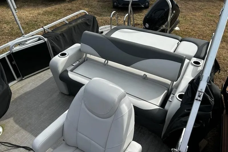 Slide: The Image of 2022 Tahoe Pontoon LTZ VRB/VRL interior with plush seating and cup holders. - 6