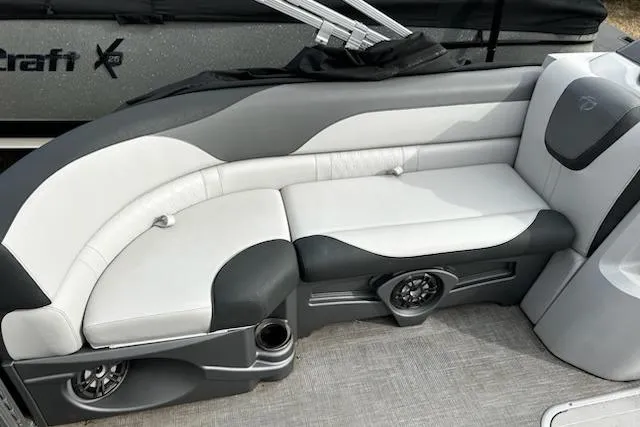 Slide: The Image of 2022 Tahoe Pontoon LTZ VRB/VRL interior seating with modern design and built-in speakers. - 9