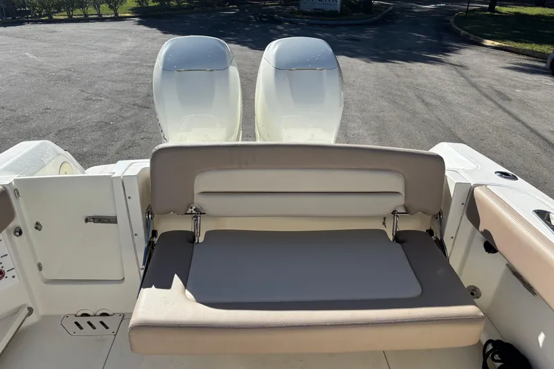 Slide: The Image of 2014 Boston Whaler 270 Vantage boat with dual engines and rear seating. - 15