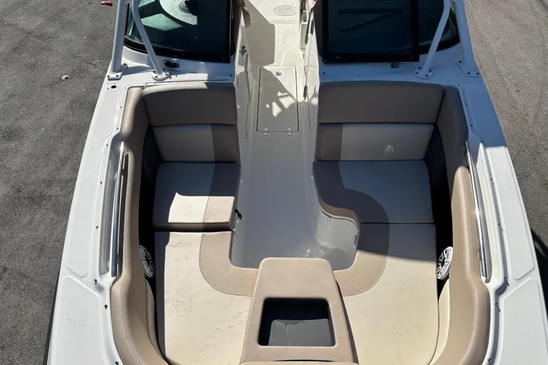 Slide: The Image of 2014 Boston Whaler 270 Vantage boat interior with cushioned seating and sleek design. - 22