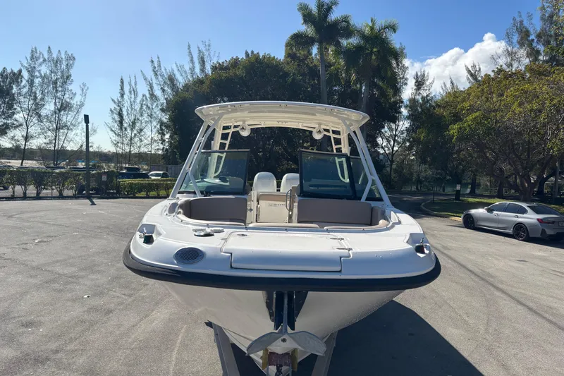 Slide: The Image of 2014 Boston Whaler 270 Vantage boat parked outdoors on a sunny day. - 9
