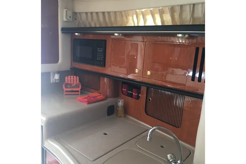 Slide: The Image of Galley to port w/undercounter refrigerator/freezer. Cherrywood cabinets - 14