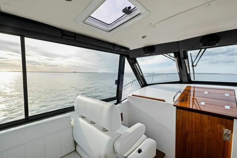 Slide: The Image of Interior view of 2025 MJM 42 yacht with ocean view through windows. - 11