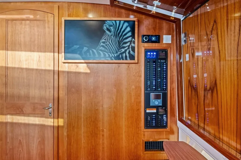 Slide: The Image of Interior of 2025 MJM 42 yacht with wood paneling and control panel. - 21
