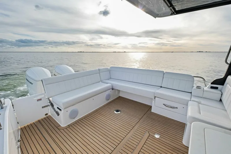 Slide: The Image of Luxury MJM 42 boat interior, 2025 model, with spacious seating and scenic ocean view. - 4