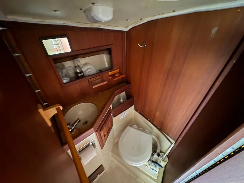 Slide: The Image of Interior of 1981 Newport 27 S sailboat bathroom with sink and toilet. - 38