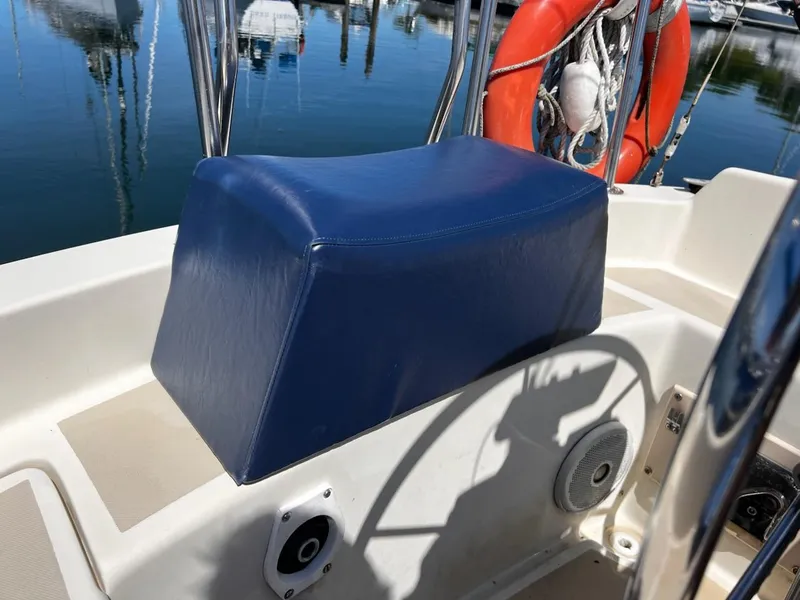 Slide: The Image of 1982 O'Day 28 sailboat cockpit with blue seat cover and life preserver. - 11
