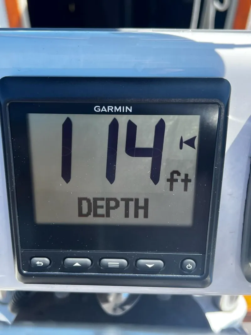 Slide: The Image of Garmin depth gauge showing 114 feet on a 1982 O'Day 28 sailboat. - 19