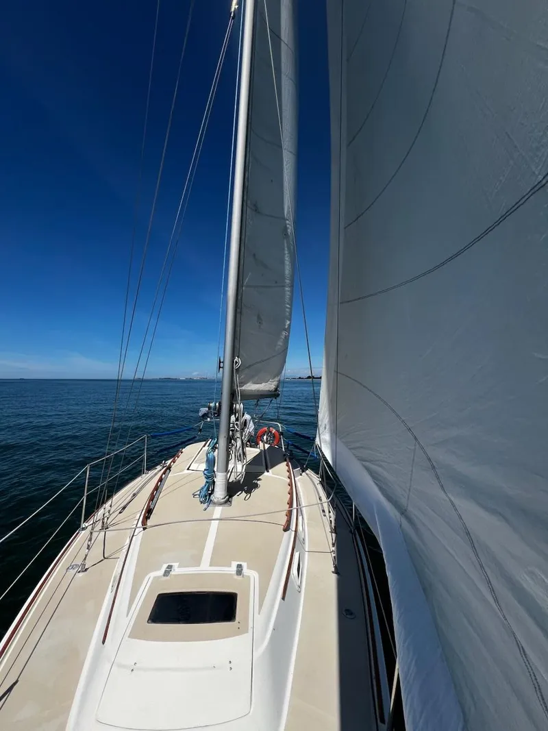 Slide: The Image of 1982 O'Day 28 sailboat on calm sea under clear blue sky. - 22