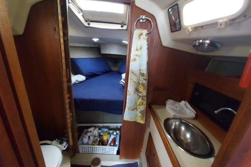 Slide: The Image of Interior of 1982 O'Day 28 sailboat with cozy cabin and compact amenities. - 29