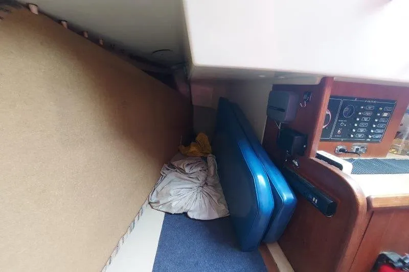 Slide: The Image of Interior of a 1982 O'Day 28 sailboat with cushions and control panel. - 34