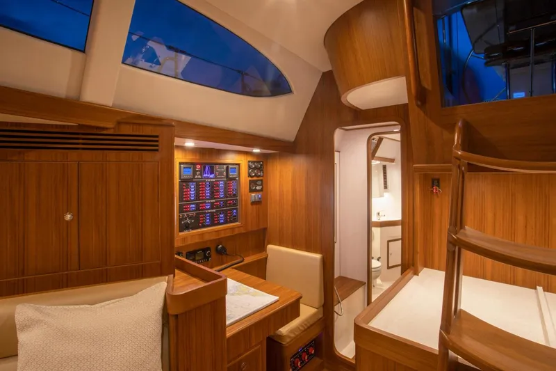 Slide: The Image of Manufacturer Provided Image: Luxurious interior of 2025 Hylas H48 yacht with wood finish and modern amenities. - 11