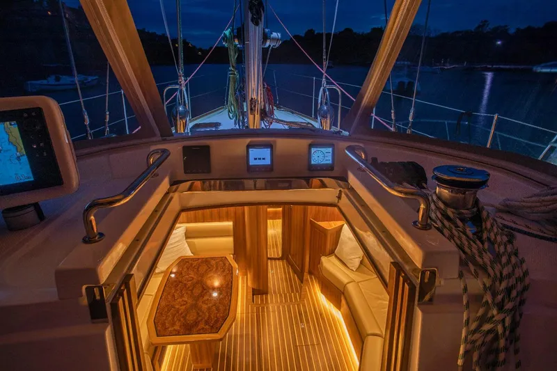 Slide: The Image of Manufacturer Provided Image: Luxurious 2025 Hylas H48 yacht interior with ambient lighting and elegant wood finishes. - 7