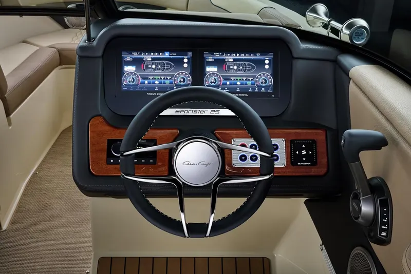 Slide: The Image of Manufacturer Provided Image: 2025 Chris-Craft Sportster 25 dashboard with dual screens and modern controls. - 14
