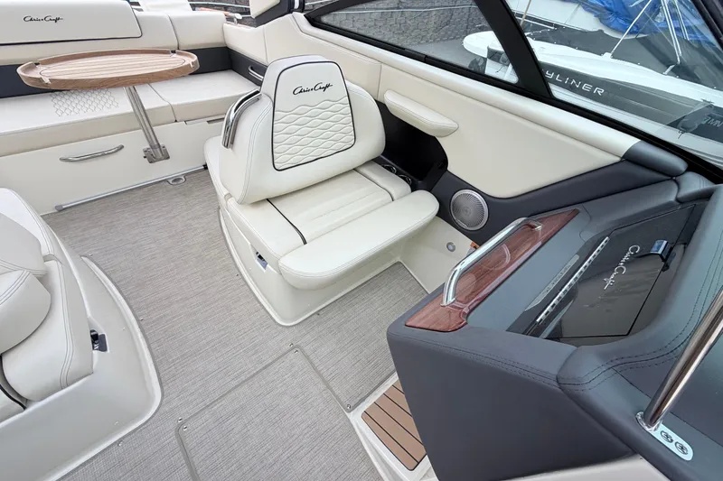 Slide: The Image of Luxurious interior of 2026 Chris-Craft Sportster 25 boat with elegant seating and dashboard. - 24