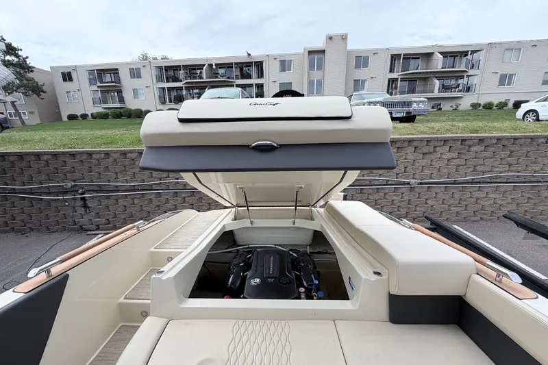 Slide: The Image of 2026 Chris-Craft Sportster 25 boat engine compartment open, showcasing modern design. - 27