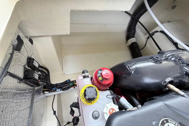 Slide: The Image of Engine compartment of 2026 Chris-Craft Sportster 25, showcasing wiring and components. - 29